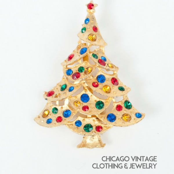 Vintage Christmas tree pin multiple stones green red blue amber pin.